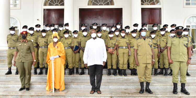 President Yoweri Museveni in a group photo with 33 CID Police Constable Graduates who have undergone an induction training course at Sera Kasenyi SFC Military Academy Military school. The President met the CID gradates at State House Entebbe on 18th May 2022. Photo by PPU/ Tony Rujuta.