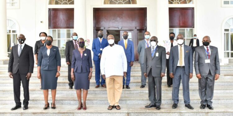 President Yoweri Museveni in a group photo with the Director of Public Prosecutions Jane Frances Abodo and her team after a meeting at the State House Entebbe on 26th May 2022. Photo by PPU/ Tony Rujuta.