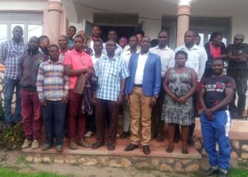 Fort Portal DRCC Allan Bamuha in a group photo with Members of Boda Boda riders SACCO