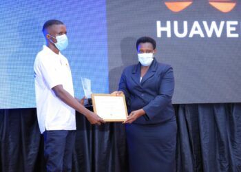 H.E Jessica Alupo, The Vice President of Uganda Awarding Olinga John Peter, Huawei Instructor who led the Uganda team to take first position in Africa Region