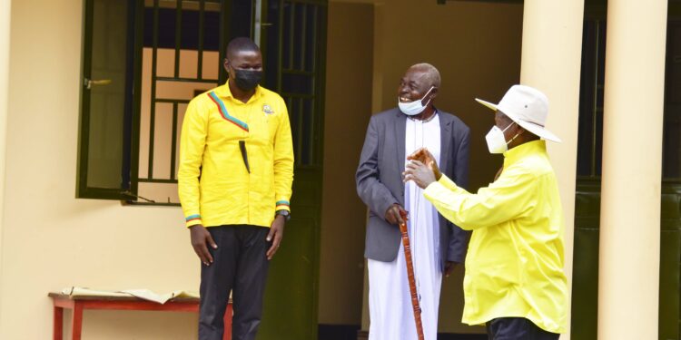 President Yoweri Museveni with Andrew Ojok and Mzee Nathan L'Okori