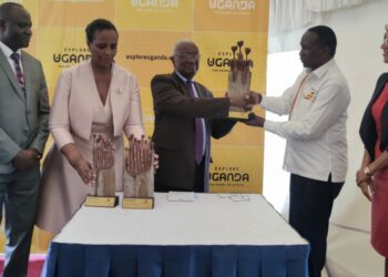 L-R: Basil Ajer, Director of Tourism at MTWA, UTB Chairperson Mrs. Susan Muhwezi, Hon Tom Butime, the Minister of Tourism, Wildlife and Antiquities receiving the award from UTB board Chairman Hon. Daudi Migereko, UTB CEO Lily Ajarova.
