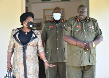 Minister Amongi (Left) interacting with the Commandant of the Senior Command and Staff College, Kimaka, Lt. Gen. Andrew Guti (right) after the lecture on Wednesday