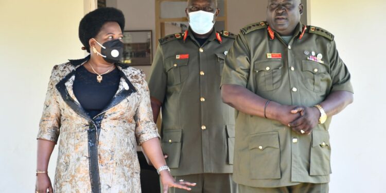 Minister Amongi (Left) interacting with the Commandant of the Senior Command and Staff College, Kimaka, Lt. Gen. Andrew Guti (right) after the lecture on Wednesday