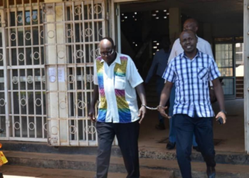 The arrested Tororo Town Clerk, Paul Omoko and the Municipal Engineer Francis Okema