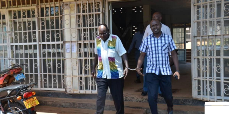 The arrested Tororo Town Clerk, Paul Omoko and the Municipal Engineer Francis Okema