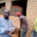 Agago DRDC Cosmas Okidi inspecting district construction works