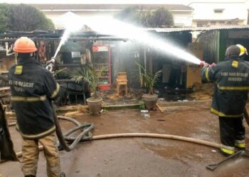 Police Fire brigade putting off the fire that broke out at one of the kiosks in the vicinity of National Theatre