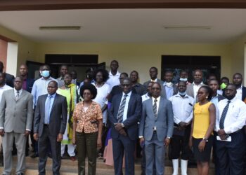 The Minister Pose with the staff of Gulu University