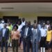 The Minister Pose with the staff of Gulu University