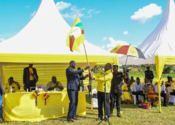 Andrew Ojok with NRM SG Richard Todwong