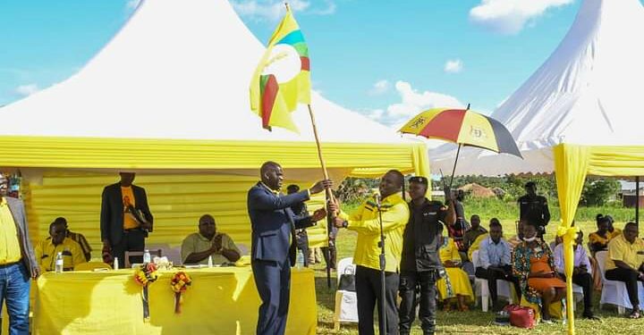 Andrew Ojok with NRM SG Richard Todwong