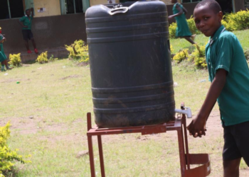 A pupil at Ibanda primary school washing hands