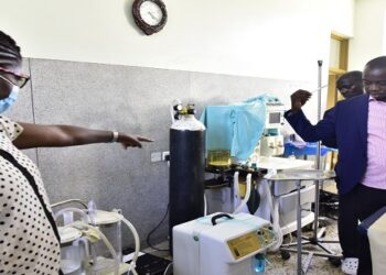 Hon. Ayume (R) in one of the wards at Budaka Health Centre