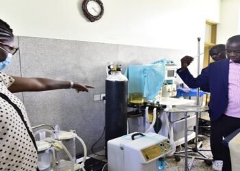 Hon. Ayume (R) in one of the wards at Budaka Health Centre