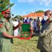 Brig. Gen Godwin Obina from Nigeria presents a gift to President Museveni shortly after the President's  opportunity lecture to officers from Nigeria National Defense College held at Baralege in Otuke on Friday