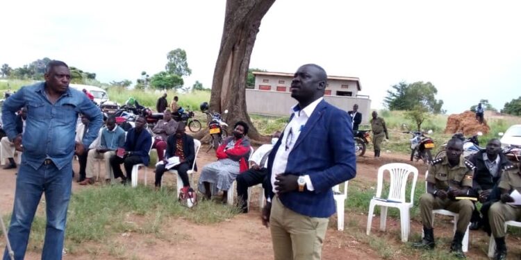 DRDC Okidi gives speech during the community dialogue.