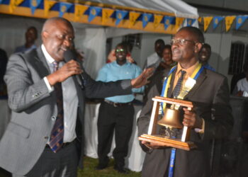 Rotarian Emmanuel  Katongole(Left)  proprietor  of Quality Chemicals Industries installing The Former Chief brewer at Nile Breweries Ltd Mr Moses Musisi(Right) as President of Rotary Club of Jinja.