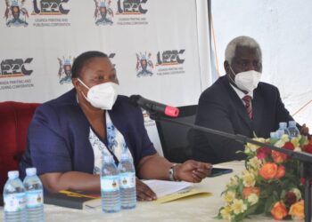 L-R: Minister Babalanda with UPPC Ag. MD Kenneth G. Oluka during a meeting at the Corporation offices in Entebbe last year