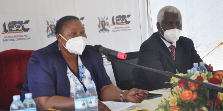 L-R: Minister Babalanda with UPPC Ag. MD Kenneth G. Oluka during a meeting at the Corporation offices in Entebbe last year