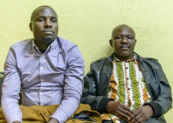 DAPCB Executive Secretary George William Bizibu (right) and DAPCB Accountant arrested