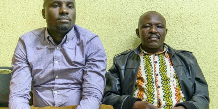 DAPCB Executive Secretary George William Bizibu (right) and DAPCB Accountant arrested