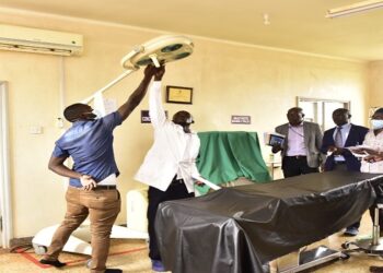 Health workers show MPs around the theatre at Wakitaka Health centre