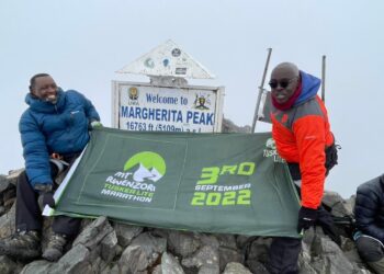 Wekesa and kabushenga at the Margherita Peak which is the highest point of the Rwenzori Mountains