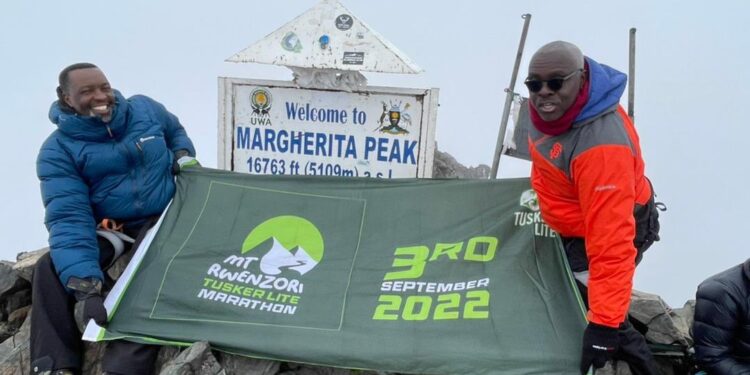 Wekesa and kabushenga at the Margherita Peak which is the highest point of the Rwenzori Mountains