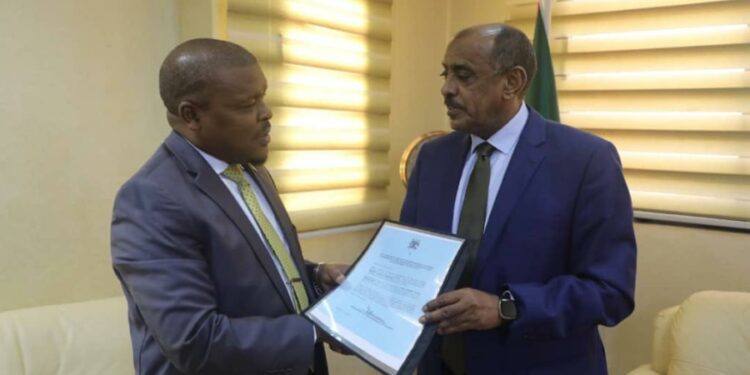 Ambassador Rashid Yahya Ssemuddu presents a copy of credentials to the Minister of Foreign Affairs of the  Republic of Sudan, Hon. Ambassador Ali Al Sadiq