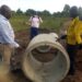 RDC Adiama inspecting the substandard culverts which were being used on Okodi Acur Road
