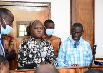 Lubega Mukaaku and and Dr Kizza Besigye in Court