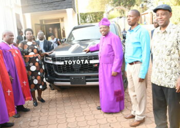 Bishop of Diocese of Kigezi Gaddie Akanjuna (3rd Right) receiving the new vehicle on July 23 in Kabale town.