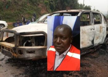 Bukwo CAO Charles Ogwang and his car that was set ablaze