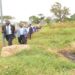 Dr. Omagino leads MPs on the committee on a tour of the land at Naguru