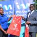 Buganda Kingdom Katikkiro Charles Peter Mayiga hands over kits to
I&M Bank’s Ronnie Zalwango.