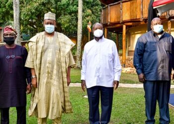 Outgoing Nigeria High Commissioner to Uganda Zanna Umaru (2nd L) poses for a photo with President Museveni at Munyonyo as he bid him farewell after concluding his tour of duty in Uganda. July 28