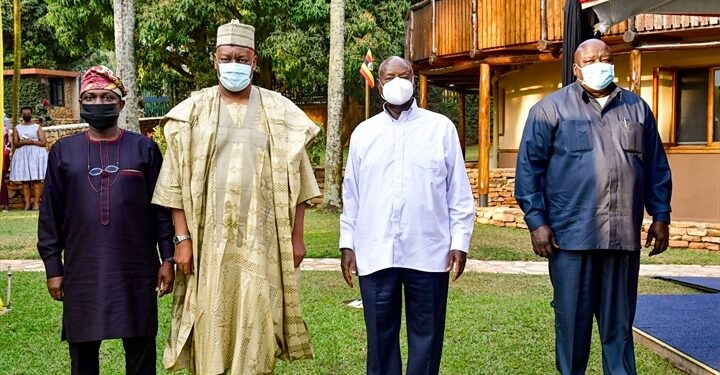 Outgoing Nigeria High Commissioner to Uganda Zanna Umaru (2nd L) poses for a photo with President Museveni at Munyonyo as he bid him farewell after concluding his tour of duty in Uganda. July 28