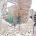 Keturah Ategeka crying near her demolished house