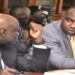 Hon. Henry Musasizi (R) was put to task to explain government's interest in buying shares in Roko Construction Ltd