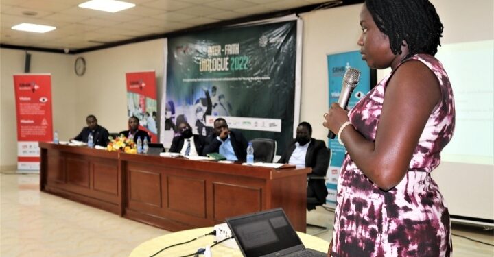 Dr Justine Nabwire addressing a panel at the Inter Religious Dialogue 2022