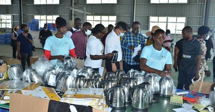 1.Workers at Sino-Uganda Mbale Industrial  Park assembling an electric kettle part of the investments at the park.PHOTO BY ANDREW ALIBAKU