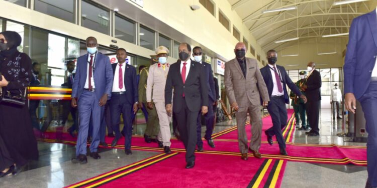 The President of the Federal Republic of Somalia H.E. Hassan Sheikh Mohamud and the Minister of Foreign Affairs Jeje Odong moving in the VIIP lobby at the VVIP Airport Entebbe on 8th August 2022. Photo by PPU/Tony Rujuta.