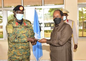 The President of the Federal Republic of Somalia H.E. Hassan Sheikh Mohamud receiving a souvenir from National Enterprise Cooperation (NEC) Managing Director Lt. Gen. James Mugira during the official visit at Luwero Defence Industries Nakasongola on 9th August 2022. Photo by PPU/Tony Rujuta.