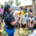 A female youth demostrates how to use a condom in Kabeywa village Kapchorwa district