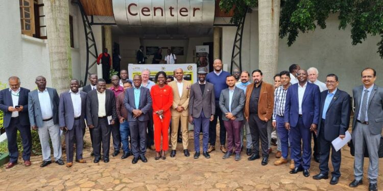 Minister Evelyn Anite, UIA officials and investors in a group photo