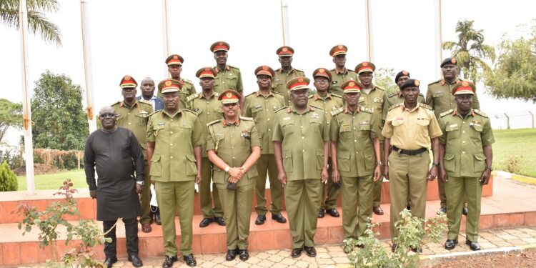 Maj-Gen-Leopold-Kyanda-in-agroup-photo-with-some-of-the-incoming-and-outgoing-Defence-Advisors