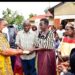 Minister Babalanda hands over President Museveni's contribution of sh5m to Mzee David Wandyete and his wife for loss of their daughter Janet Nekesa