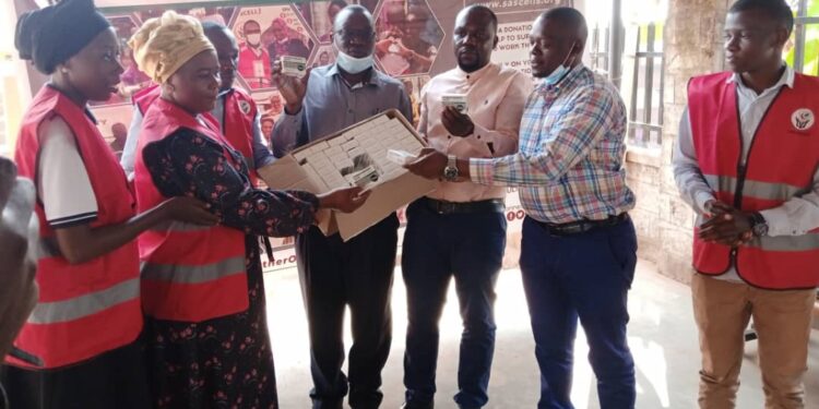 Sarafina Sickle Cell Society handing over the medicine to Mukono General Hospital sickle cell clinic management.