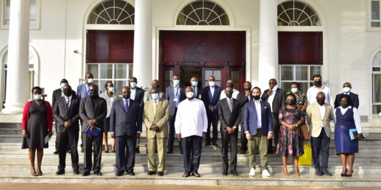 President Yoweri Museveni in a group photo with Coffee traders, Producers and growers after a meeting at State House Entebbe on 14th September 2022. Photo by PPU/Tony Rujuta.